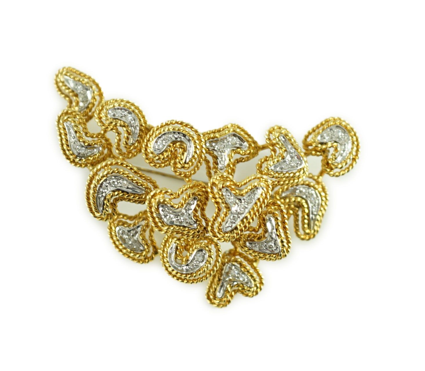 A modern stylish Italian 750 gold and diamond chip set modernist brooch